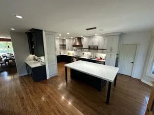 Modern kitchen with recessed ceiling lights, under-cabinet lighting, and island pendant fixtures